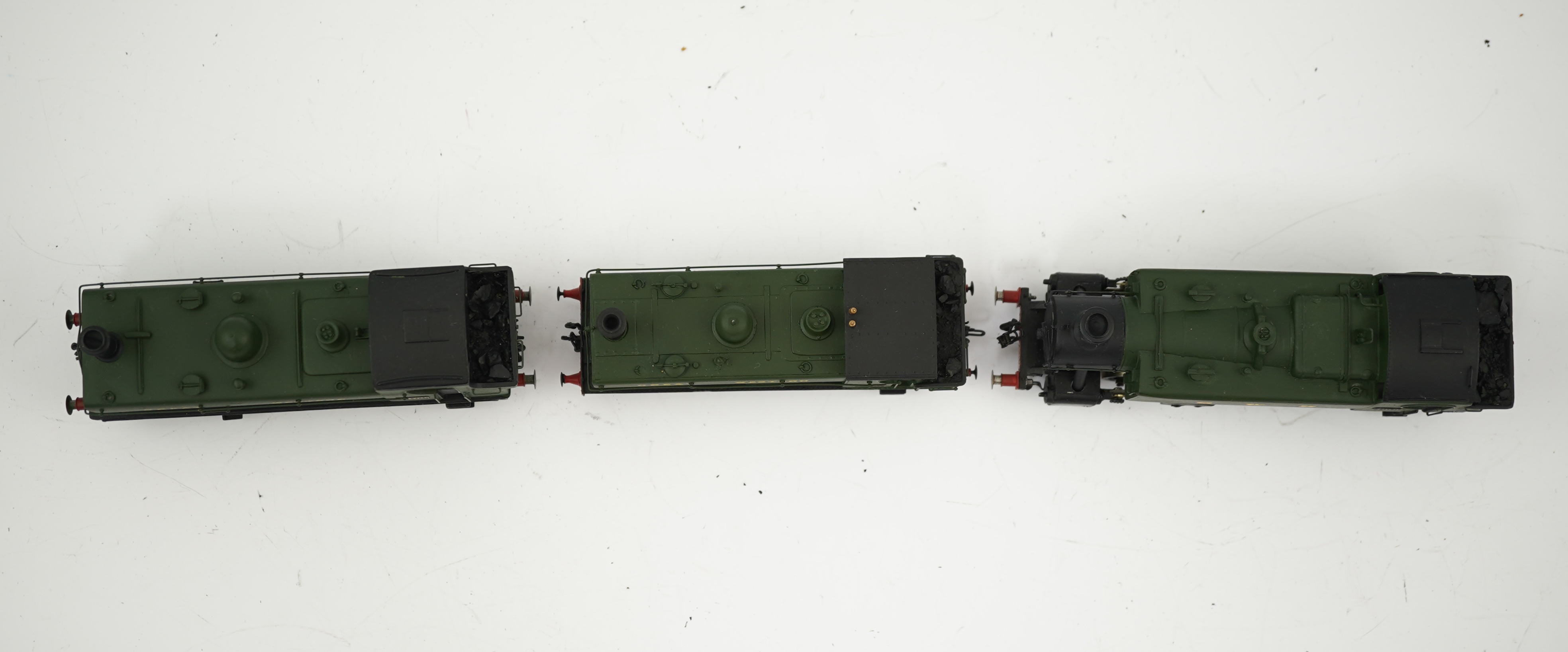 Three 00 gauge brass and white metal kit built GWR tank locomotives; a 15xx class 0-6-0T, 1500, together with an 54xx class 0-6-0PT, 5406, and a 19xx class 0-6-0PT, 1925, all constructed, painted and lined to a high stan